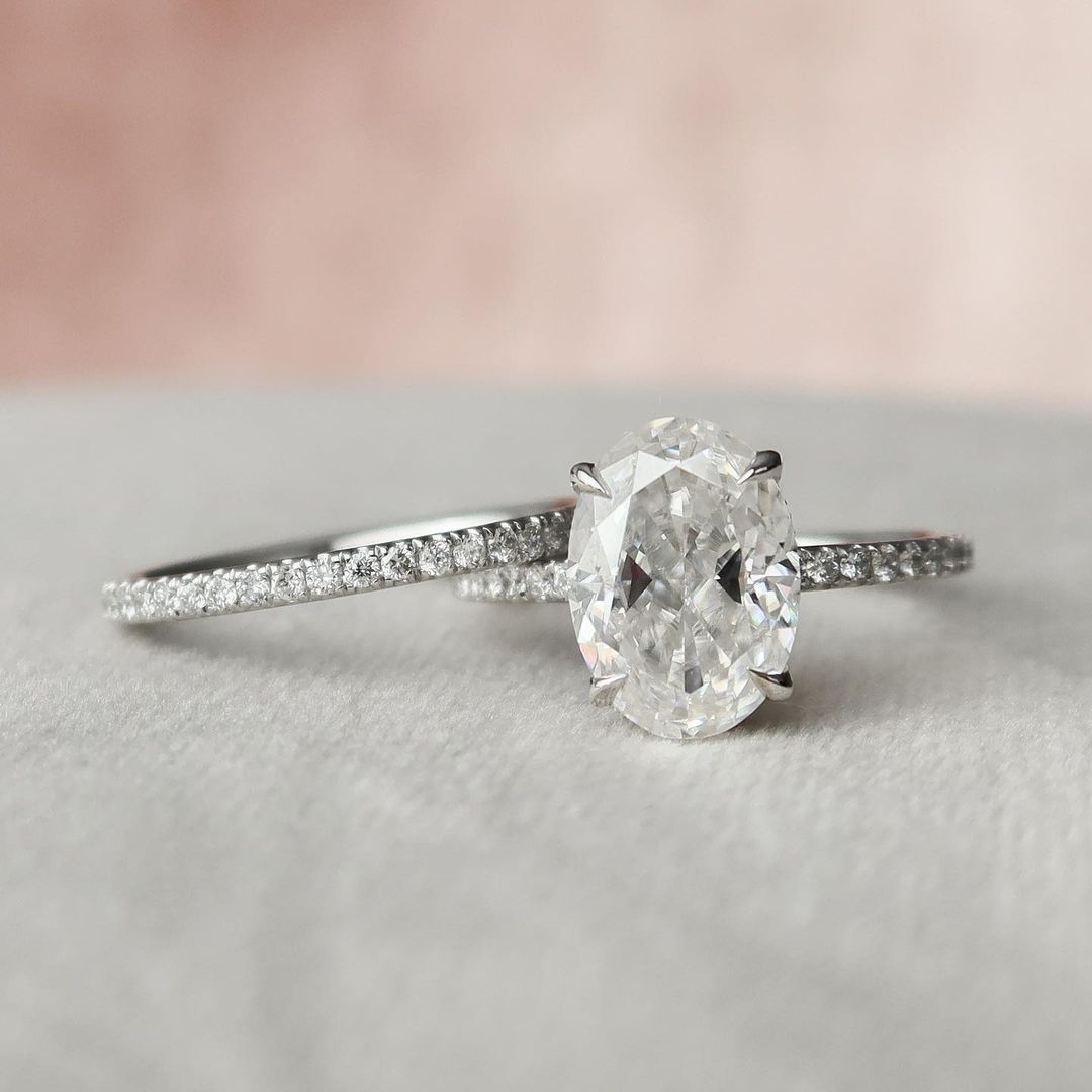 2 CT Oval Cut Lab Grown Diamond Engagement Ring Bridal Set with a dazzling pave setting. The perfect Anniversary Day gift set for her.