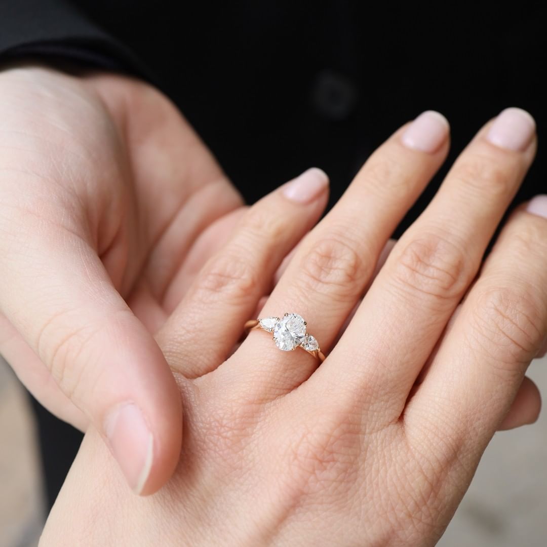 2 CT Oval Cut Lab Grown Engagement Ring in 18K Gold. A vintage-inspired, uniquely bezel-set promise of minimalist wedding bliss.