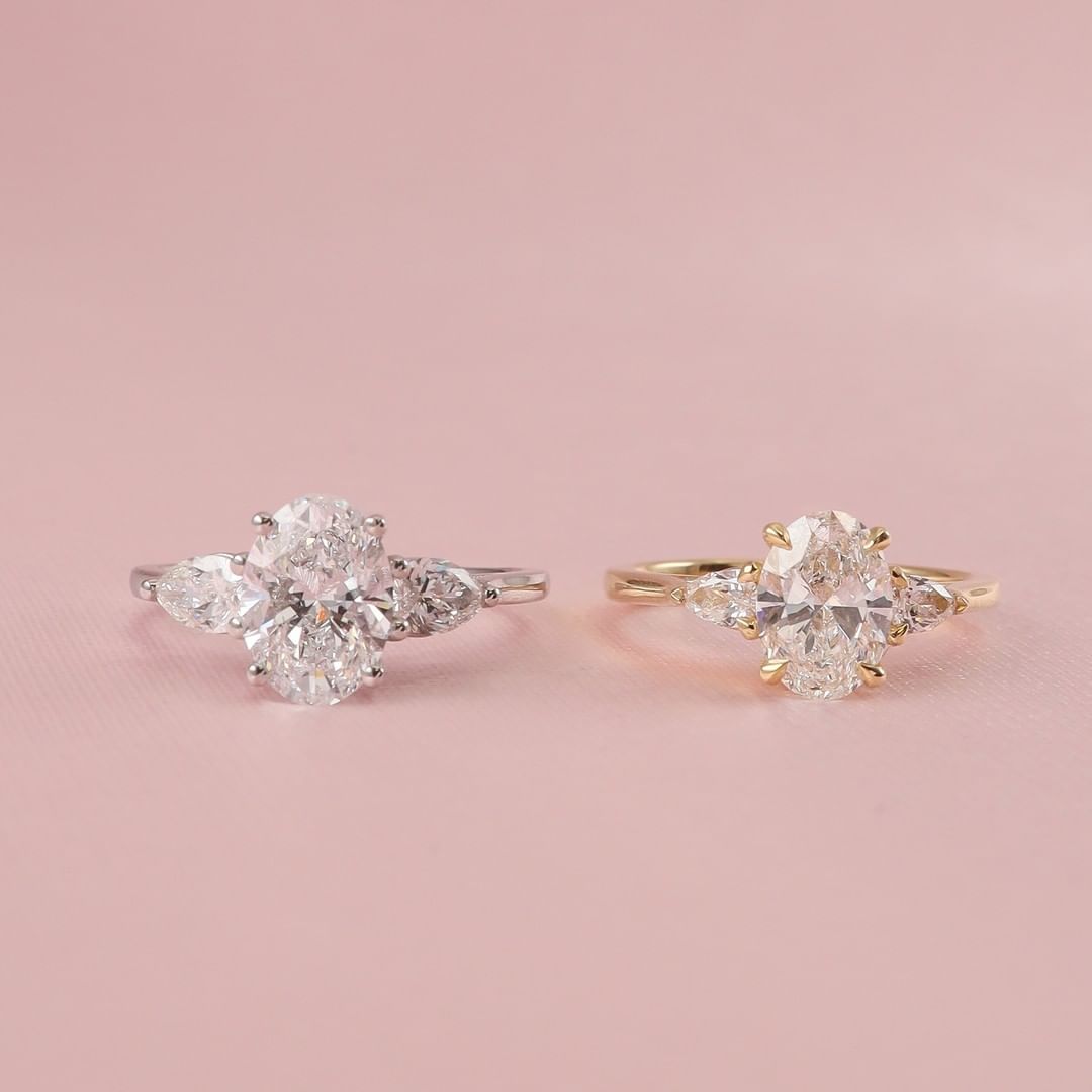 2 CT Oval Cut Lab Grown Engagement Ring in 18K Gold. A vintage-inspired, uniquely bezel-set promise of minimalist wedding bliss.