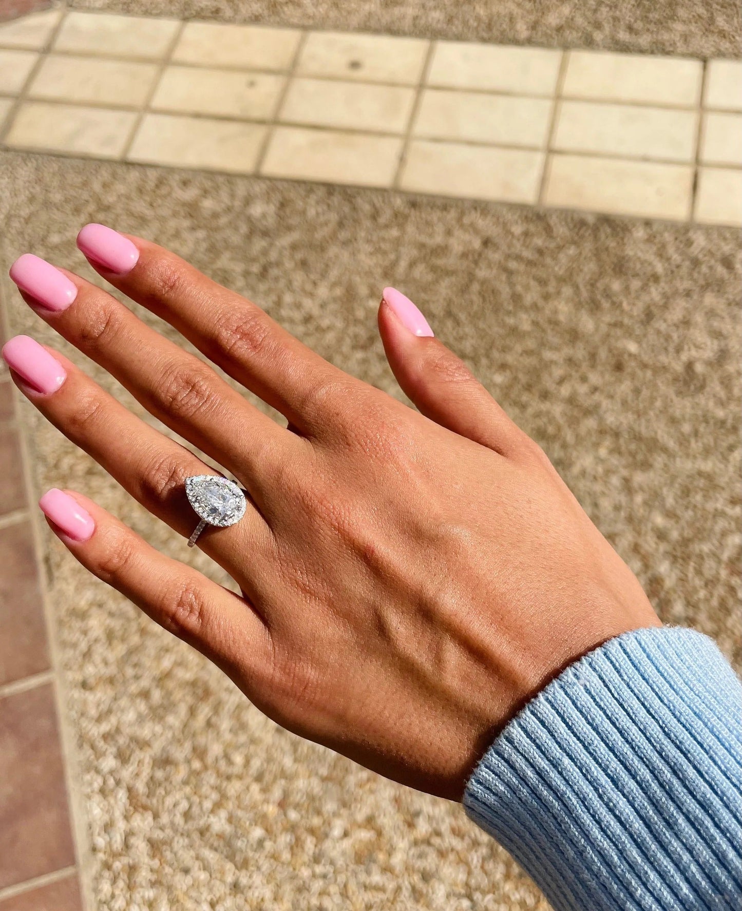3 CT Pear Cut Lab Grown Diamond Engagement Ring with a sparkling halo and pave setting. The perfect Valentine's Day gift for her.
