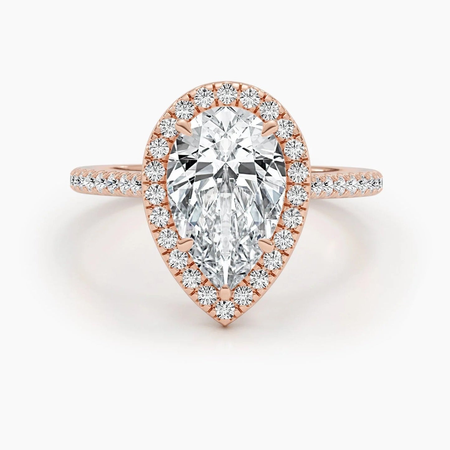 3 CT Pear Cut Lab Grown Diamond Engagement Ring with a sparkling halo and pave setting. The perfect Valentine's Day gift for her.