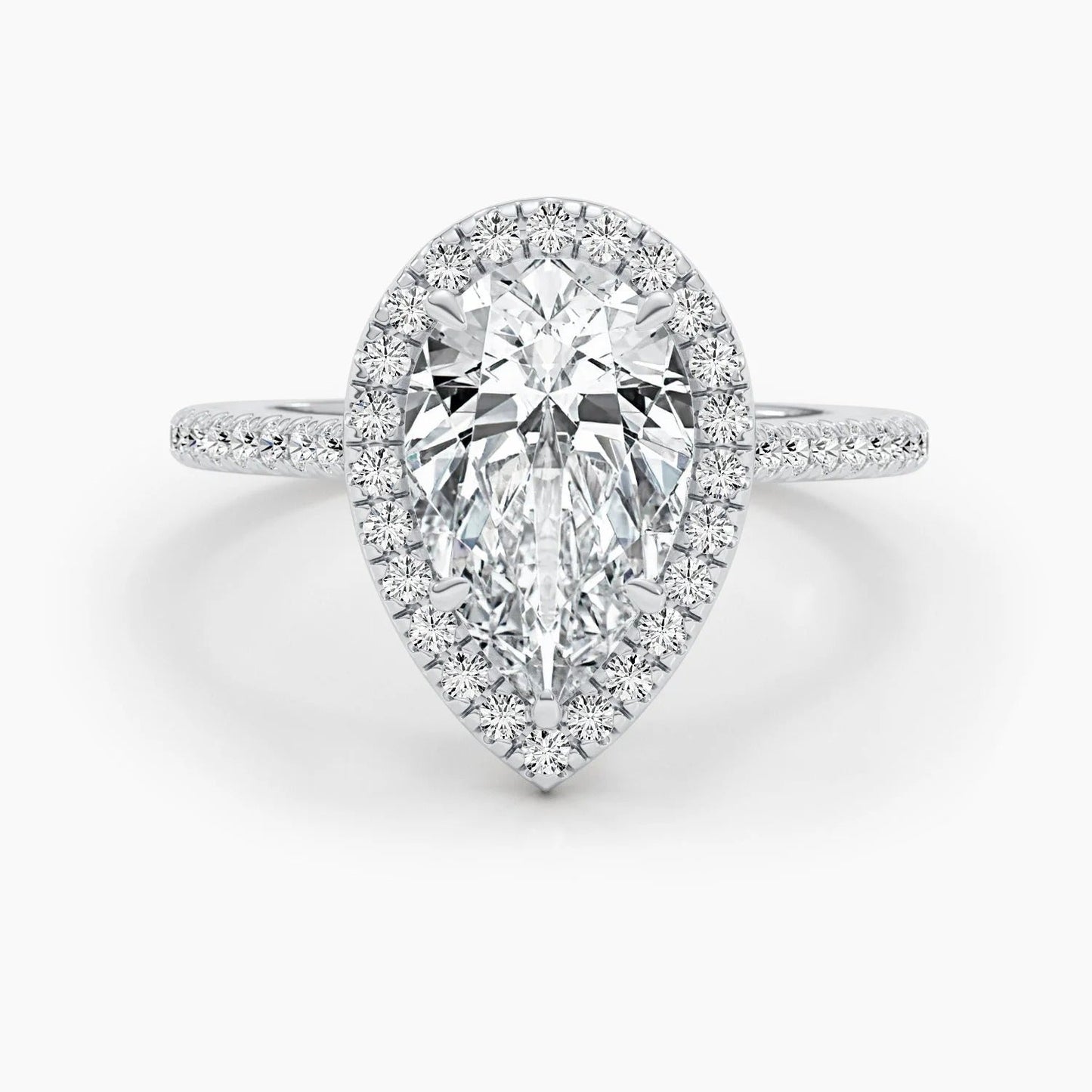 3 CT Pear Cut Lab Grown Diamond Engagement Ring with a sparkling halo and pave setting. The perfect Valentine's Day gift for her.