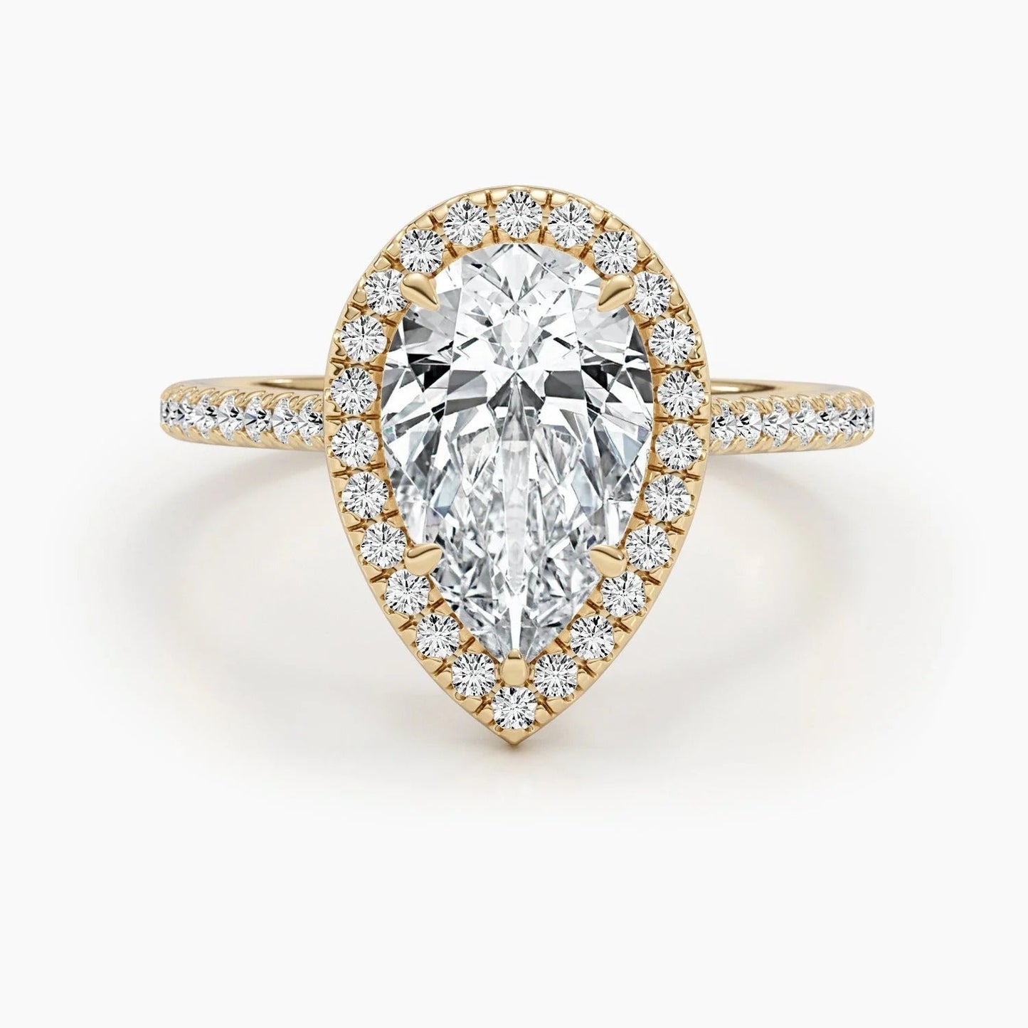 3 CT Pear Cut Lab Grown Diamond Engagement Ring with a sparkling halo and pave setting. The perfect Valentine's Day gift for her.