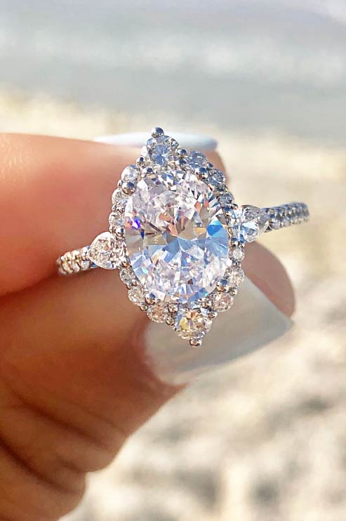 3 CT Oval Cut Lab Grown Diamond Engagement Ring Bridal Set with a dazzling pave setting. The perfect Anniversary Day gift set for her.